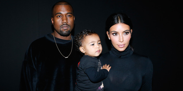 Kanye West, Kim Kardashian and their daughter North West attend the Balenciaga show as part of the Paris Fashion Week. Photo / Getty
