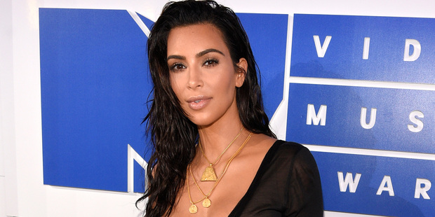 On Keeping Up With the Kardashians, Kim Kardashian told her shocked-looking family she wanted to explore surrogacy. Photo / AP