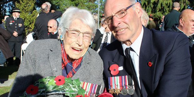 World War II nurse, Beatrice (Betty) Erica Wakely (Regiment No. 811713) and her son Dennis wearing his father's World War II medals, at this year’s Anzac Day civic service at the Dannevirke Cenotaph.