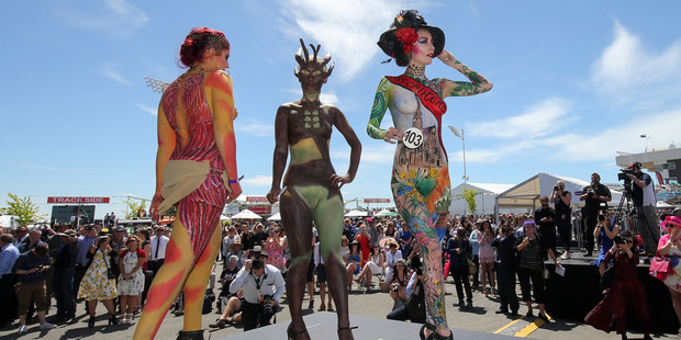 Contestants in the Body Art competition pose during New Zealand Trotting Cup Day at Addington Raceway in Christchurch. Photo / Getty Images