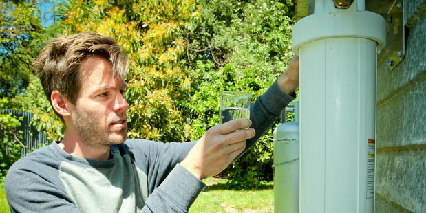 Hastings brewer Matt Smith, owner of Brave Brewing Co, with the carbon filter he has installed to extract the chlorine during beer production. PHOTO/WARREN BUCKLAND