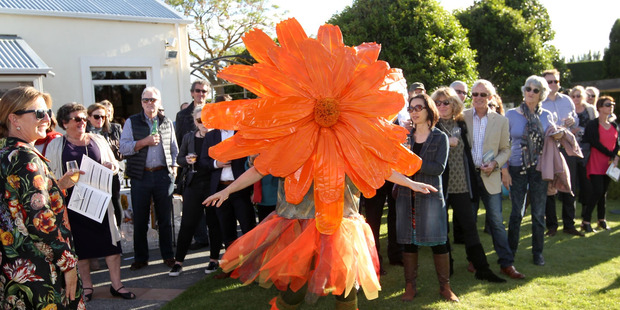 Display: Calendula, one of six human wildflowers at the opening party for the Wildflower Sculpture Exhibition, at Round Pond Garden held in support of the Cranford Hospice. Photo/Duncan Brown.