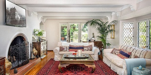 The living room features an open fireplace. Photo / Coldwell Banker