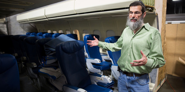 Rich "RJ" Rappaport shows part of a prop airplane interior. Photo / Kevin D. Liles