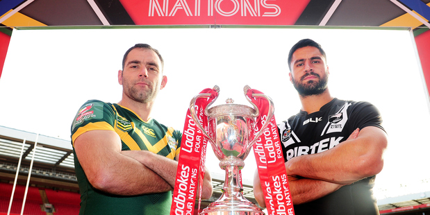 Australian skipper Cameron Smith and Jesse Bromwich of New Zealand with the Four Nations trophy. Photosport
