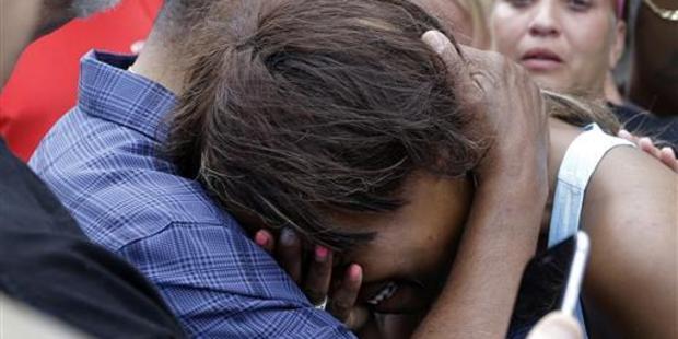 Diamond Reynolds, Castile's girlfriend, who filmed the fatal traffic stop, is consoled as she talks about the shooting. Photo / AP