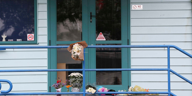 Floral tributes outside the Angels Childcare centre in Takapuna after a four year old boy died yesterday. Photo / Chris Loufte