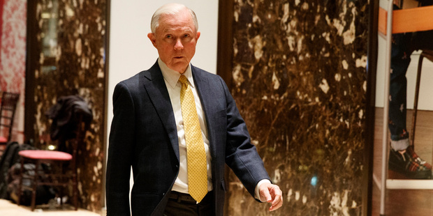 Sen. Jeff Sessions, R-Ala., talks with reporters as he arrives at Trump Tower. Photo / AP