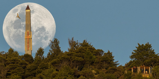 THE MOON AND THE MONUMENT: Whangarei photographer Ross Armstrong couldn't believe his luck when a hawk flew into shot as he lined up this rare supermoon and the war memorial on Mt Parihaka.