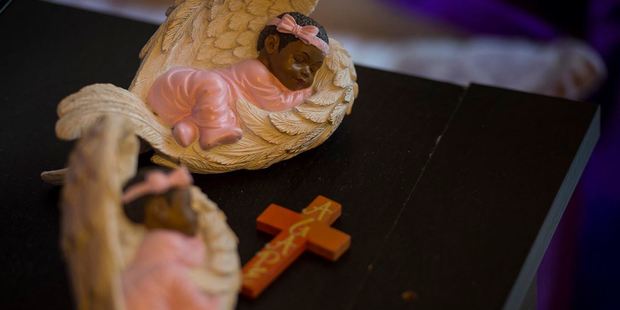 A pair of angels sit on a table at the Johnson home in Northeast D.C. Photo: Nikki Kahn, The Washington Post.