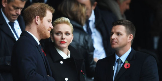 Prince Harry (L) and Princess Charlene of Monaco (C) are seen in the stand prior to the Old Mutual Wealth Series match between England and South Africa. Photo / Getty Images