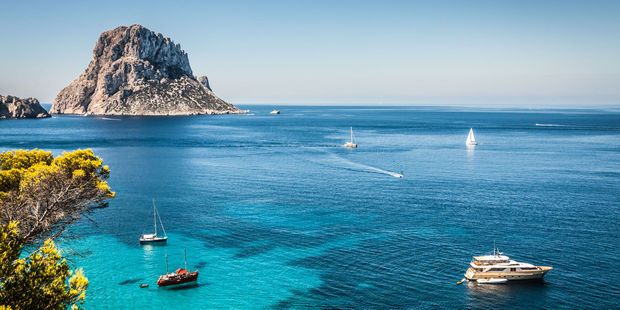 Boats explore off the coast of Ibiza. Photo / 123RF