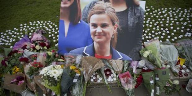 Floral tributes lie outside Parliament House in London for murdered British MP Jo Cox. Thomas Muir has been convicted of killing her. Photo / AP