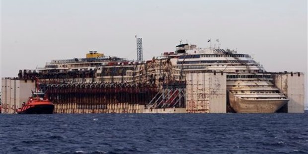 The salvaging of the Costa Concordia cruise ship took two years and a considerable amount of money. It is towed by tugboats towards Genoa's harbour in July 27, 2014. Photo / AP