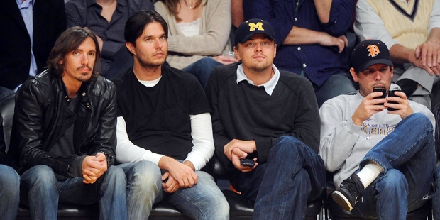 Lucas Hass, Adam Farrar (Leo's brother), Leonardo DiCaprio and Kevin Dilon (L-R) sit courtside as they attend the Los Angeles Lakers/Miami Heat NBA game. Photo / Getty 
