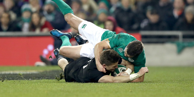 Beauden Barrett is in no doubt he grounded the ball in a controversial try during the All Blacks victory over Ireland this morning. Photo / Getty