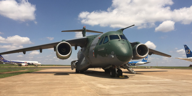 The KC-390 with new commercial planes in the background. Photo / Grant Bradley