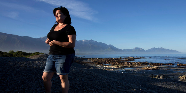 Lyn Collins pictured on the beach at Kaikoura where she has returned to from Australia to care for her elderly parents after the earthquake. Picture / Alan Gibson