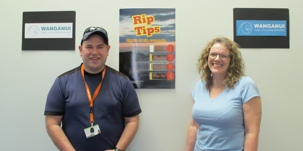 Logo designer Paul Pert with Melanie Miller and his graphic designs. PHOTO/LIZ WYLIE