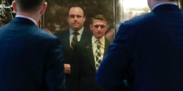 Retired Lt. Gen Michael Flynn, centre, arrives at Trump Tower last week. Photo / AP