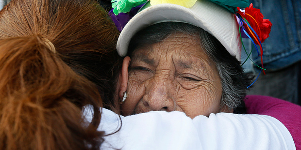 A grandmother cries during a demonstration in Mexico City today. The demonstrators mostly comprised of women travelling through Mexico to search for their missing relatives. Photo / AP