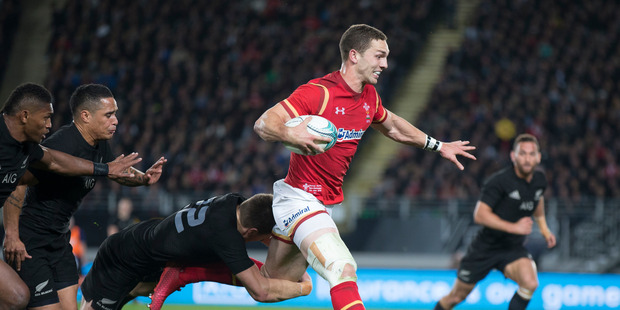 Welsh Wing George North breaks the tackle by Beauden Barrett during the first test match against Wales at Auckland's Eden Park. Photo / Nick Reed.