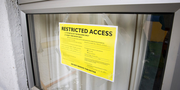 This yellow sticker shows restricted access to the house in Waiau. Photo / Mike Scott