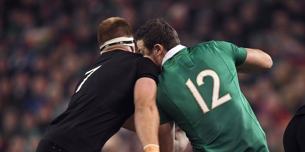 Robbie Henshaw of Ireland is tackled by Sam Cane of New Zealand which subsequently led to Henshaw being carried off the pitch on a stretcher. Photo / Getty Images