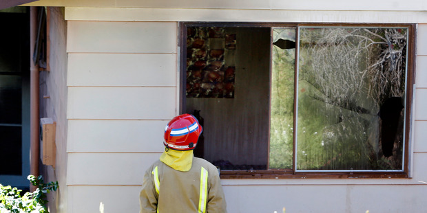 Neighbours reported seeing smoke pouring out of this home on Raumanga Heights Drive which was severely damaged by a fire yesterday. Photo / John Stone