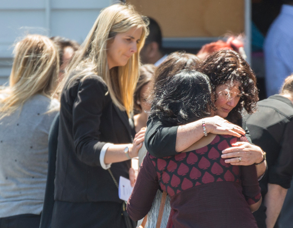 Mourners outside the front of the Immaculate Conception Church in Ellerslie after the funeral of 4 year old Aldrich Viju. Photo / Peter Meecham