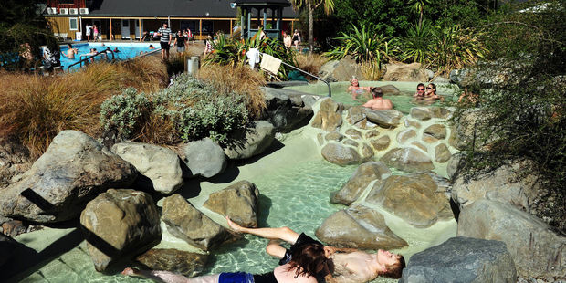 Tourists enjoying hot pools in Hanmer Springs. Photo / 123RF