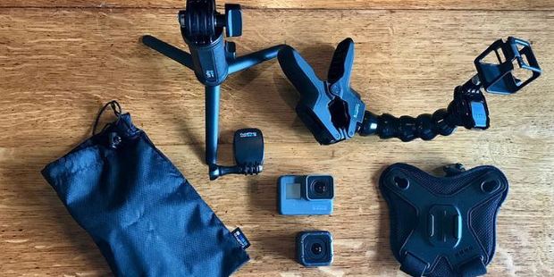 GoPro Hero5 and Hero5 Session surrounded by camera accessories.
