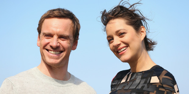 Michael Fassbender & Marion Cotillard pose during a photo call for Assassin's Creed. Photo / Getty