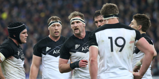Captain Kieran Read talks to his players against France. Photo / Getty Images