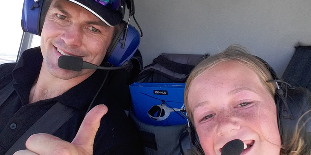 Stevie Dineen, 11, took a selfie with Richie McCaw on her surprise chopper flight. Picture / supplied