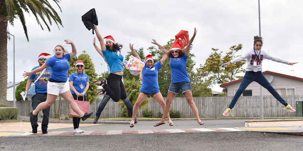 Bay of Plenty Times staff and volunteers during a collection for the Tauranga Community Foodbank in Papamoa last year. The appeal is happening again this year, with a collection in Greerton tonight.