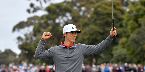 Dane Thorbjorn Olesen celebrates after sinking his putt on the 18th green yesterday. Photo / AP