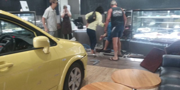 The car sent customer and furniture flying. Photo / Jenny Gu