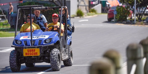 Police and lifeguards during the search for the body of a missing teen in Mount Maunganui. Photo/George Novak