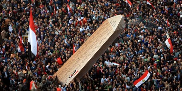 At a huge rally in Tahrir Square on January 25, 2012, Egyptian protesters carried an obelisk with the names of those killed during 2011 uprising. Photo / AFP