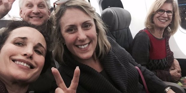 Actress Andie McDowell (far left) travels with the commoners in coach. Photo / Twitter, Andie McDowell