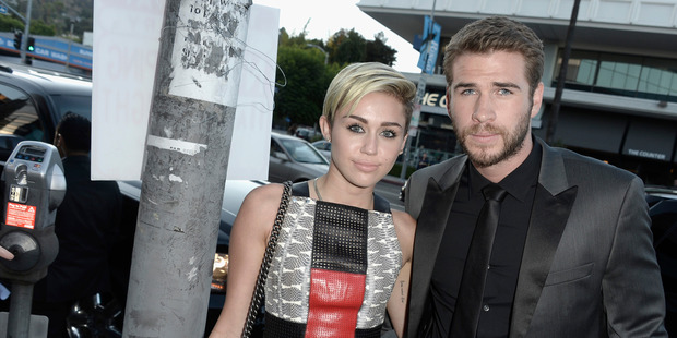 Miley Cyrus and Liam Hemsworth aren't moving into his home they reportedly have an entirely new pad. Photo / Getty