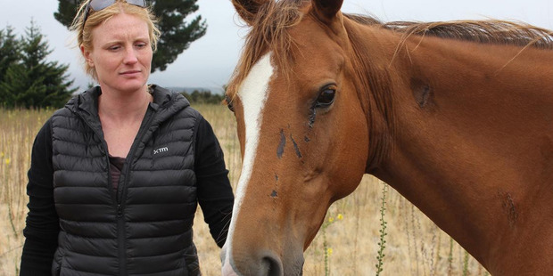 Nicky Sygrove, of Wanaka, with Misty the horse, who almost died on Saturday after being left tied to a tree by a stranger. Photo / Otago Daily Times / Margot Taylor