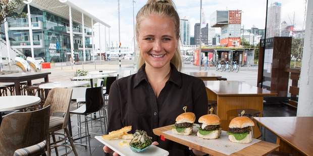 Marvel Bar & Grill waiter Britta Schafer presents the two Oceanz Blue paua dishes that will be served up at the Auckland Seafood Festival. Photo / Nicola Topping
