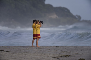 Search underway at Mount Maunganui for a teenager missing off Leisure Island. The teen was swept off the rocks by a large wave yesterday evening 24 January 2016 Bay of Plenty Times Photograph by G