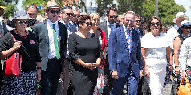 Labour deputy leader Annette King, Andrew Little, Greens co-leaders James Shaw and Metiria Turei, Nikki Kaye, John Key and Hekia Parata walk onto the marae. Photo / Mark Mitchell