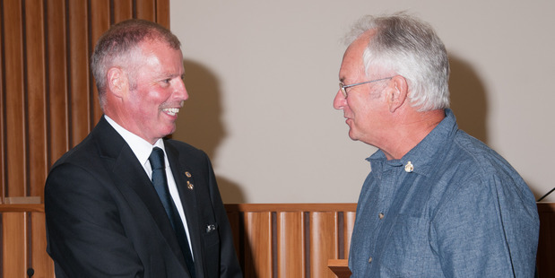 Bruce Gordon and Brian Carter congratulate each other as they become new Justices of the Peace.