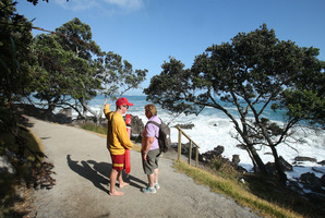 Mount lifeguard William Dansereau turns walker Beverley Webber away from the base track. Photo/John Borren