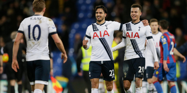 Tottenham's Dele Alli, right, and Nacer Chadli, centre, celebrate after the English Premier League soccer match between Crystal Palace and Tottenham Hotspur. Photo / AP.