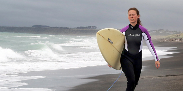 QUICK RESPONSE: Whanganui surfer Melina von Kwiatkowski assisted swimmers caught in a rip at Castlecliff's North Mole on Monday. PHOTO/STUART MUNRO